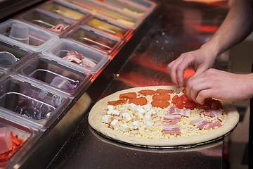 Image showing making pizza at kitchen of pizzeria