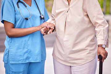 Image showing People, hand and holding of elderly for assistance with mobility, support or health with walking. Diverse, women or person with caregiver in hospital, clinic or nursing home in retirement for checkup