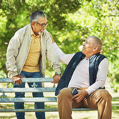Image showing Senior friends, men and support on park bench, talk and bonding outdoor to relax. Happy elderly people sitting together in garden, comfort in communication and conversation in nature for retirement