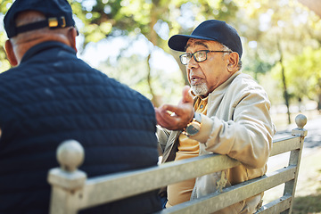 Image showing Elderly men, park and communication with friendship in garden, relax or reunion on bench in sun. Diversity, closeup and senior people with community for support, retirement and discussion on life