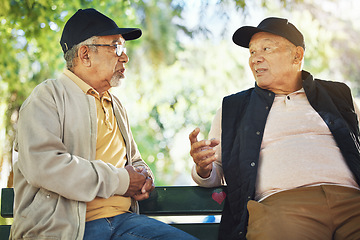 Image showing Elderly men, park and communication with friendship, nature and conversation with bonding on bench. Diversity, closeup and old people with community for socialize, relaxation and discussion on life