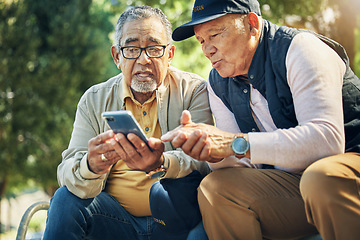 Image showing Senior men, friends and phone in park, reading and talk with memory, thinking and relax in sunshine. Elderly people, smartphone and talking on bench, nostalgia and check social media notification