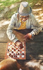 Image showing Senior men, chess and game in park, above and moving with strategy, problem solving or competition. Elderly friends, retirement and playing together for contest with king, queen and knight in summer