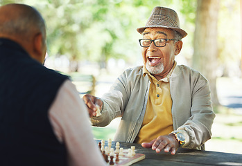 Image showing Winning, chess and senior man outdoor or friends in game of strategy in retirement for mental challenge. Boardgame, success and elderly person in park, woods or nature and move king in checkmate