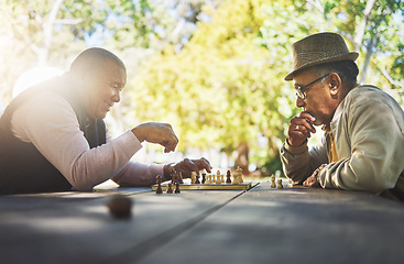 Image showing Elderly men in park, chess game and strategy with competition or challenge, friends in retirement and intelligence. Thinking, planning and contest outdoor, concentration on boardgame and recreation