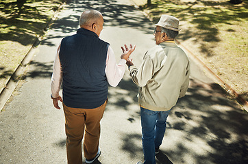 Image showing Senior, friends walking and talking in park, nature and outdoor in retirement with support and communication. Elderly, men and above people on sidewalk in Chicago with conversation and community