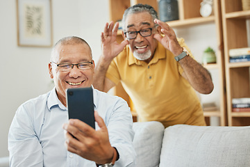 Image showing Mature men, friends or smartphone for video call, home or smile on couch in living room, house and happiness. Hands, social media apps and online communication for retirement, conversation and family