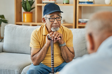 Image showing Doctor, consultation and senior man on sofa with walking stick or counselling discussion in therapy with psychologist. Elderly patent, talking and therapist listening on couch in mental health office