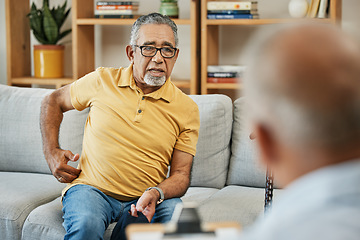 Image showing Doctor, consultation and senior man on sofa with walking stick or discussion of pain in physical therapy with checklist. Therapist, consulting and talking elderly patient on couch in rehabilitation