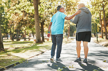 Image showing Senior friends, walk and talk in park in retirement, fitness and wellness in outdoors. Elderly people, talking and chatting in nature, workout and cardio for health, supportive in conversation