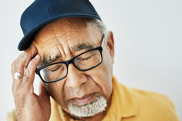 Image showing Headache, pain and face of senior man with fatigue, burnout or problem with health on white background. Stress, migraine and frustrated elderly person with hand on head in retirement with anxiety