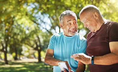 Image showing Talking, men and a phone in a park for fitness, training results and conversation about an app. Happy, communication and senior friends with a mobile to monitor health after exercise or running