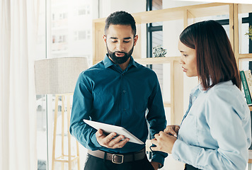 Image showing Business people, tablet and communication for partnership, meeting or project management in office. Professional, man and woman with touchscreen or discussion, planning or recruitment at workplace