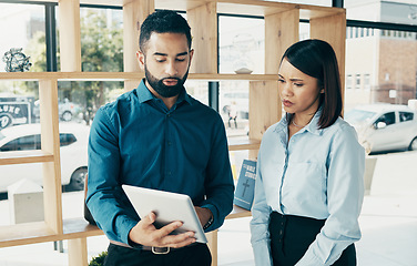 Image showing Business, woman and man with tablet for communication, meeting and project management in office. Professional, people and employees with touchscreen for planning, discussion or recruitment at work