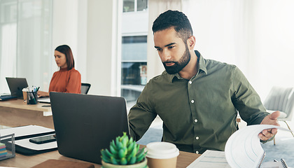 Image showing Business man, laptop and documents for finance analysis, budget report and startup revenue or taxes review in office. Professional worker reading computer with accounting paperwork, audit or planning