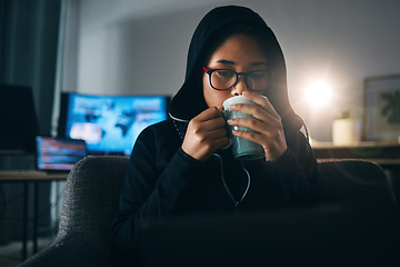 Image showing Hacker woman, coffee and night for coding, thinking and ideas for cybersecurity, data phishing and ransomware. Programmer, dark room and sofa to drink matcha for it scam, software or research on web
