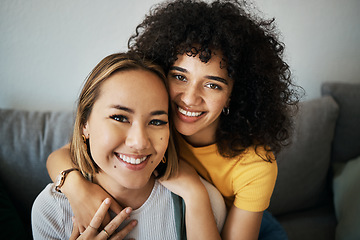 Image showing Lesbian, couple and portrait of hug on sofa in home, living room or apartment with love, support and happiness. Lgbt, women and profile picture together on lounge couch with smile on face in house