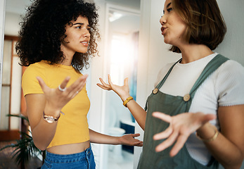 Image showing Lgbtq, women and couple with conflict, fight or problem in hallway or living room of home and frustrated. Lesbian, people and partner with anger or stress in lounge of house for crisis or argument