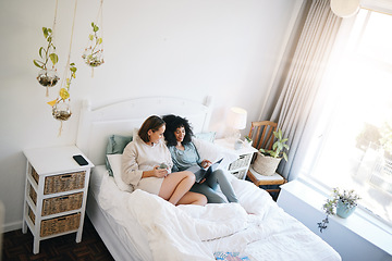 Image showing Lgbt, couple and relax on bed with laptop in home with social media, internet or streaming online watching movie. Happy, together and lesbian women in bedroom to watch video, peace and website