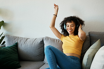 Image showing Headphones, music and woman dance on a sofa with podcast, album or audio track at home. Radio, earphones and female person having fun in living room with feel good subscription, streaming or freedom