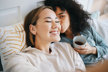 Image showing Women, lesbian and kiss in bedroom with happiness, romantic and intimate for marriage with love. LGBTQ, diversity and bisexual couple with communication for support and smile at home with respect