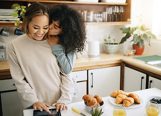 Image showing Lesbian, couple and kiss in kitchen with breakfast in morning together with nutrition, love and support in home. Lgbt, women or cooking with food, juice and preparing healthy diet on counter in house