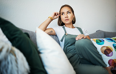 Image showing Woman, face and thinking on couch of home for peace, relaxing and living room in apartment. Person, calm and wellness for self care and zen with ideas, thoughts and inspiration in lounge on sofa