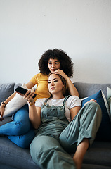 Image showing Love, television and a lesbian couple watching a movie on a sofa in the living room of their home together. Relax, LGBT and a woman with her girlfriend enjoying series on a streaming service