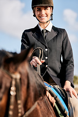 Image showing Portrait, equestrian and a woman jockey with her horse on a ranch for sports, training or a leisure hobby. Smile, riding or competition and a happy young rider in uniform with her stallion outdoor