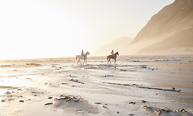 Image showing Woman, friends and horse riding for sport at beach with back view while traveling on vacation, trip or wellness. People, together and race for bond, self care and adventure on holiday with sunset