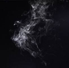 Image showing Steam, fog or gas in a studio with dark background by mockup space for magic effect with abstract. Incense, smoke or vapor mist moving in air for cloud smog pattern by black backdrop with mock up.