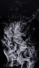 Image showing Smoke, black background and steam, fog or gas on mockup space wallpaper. Cloud, smog and magic effect on dark backdrop of mist with abstract texture, pollution pattern and incense vapor moving in air