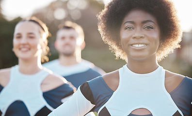 Image showing Smile, fitness and a cheerleader group outdoor together for support, motivation or competition in summer. Face, health and wellness with a sports team at an event in a park or on a field of grass