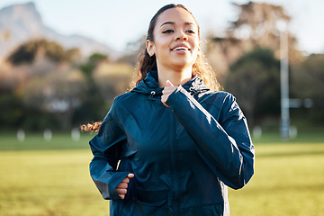 Image showing Fitness field, wellness and woman running for outdoor exercise, cardio workout or training for marathon race. Sports warm up, nature sunshine and morning runner doing athlete challenge on grass pitch