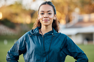 Image showing Coach, sports and portrait of woman on field with confidence for training, planning and game strategy. Happy, pride and personal trainer outdoors for exercise, workout schedule and fitness routine