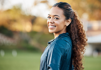 Image showing Woman, training and portrait in field, smile and excited for running, fitness or wellness in summer. Sports girl, happy and outdoor for exercise, workout or health for athlete development in sunshine