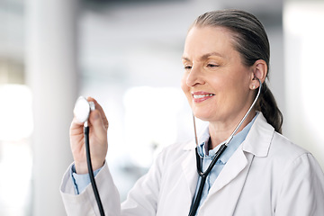 Image showing Senior woman, doctor and healthcare with stethoscope, smile and appointment with career success. Mature person, medical professional and happy employee with hospital equipment, worker and medicare