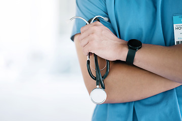 Image showing Closeup, hands of surgeon and arms crossed with stethoscope in hospital, surgery or clinic mockup. Cardiology doctor with medical tools of consulting, healthcare services or cardiovascular evaluation