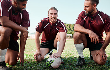 Image showing Team building, huddle and rugby players on a field planning a strategy for a game, match or tournament. Sports, fitness and captain talking to group at training or practice on an outdoor pitch.