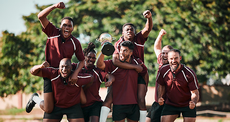 Image showing Excited, portrait and rugby team with trophy in celebration at field outdoor for target, champion goal and competition. Fitness, group of men and award for winning game, success and sport achievement