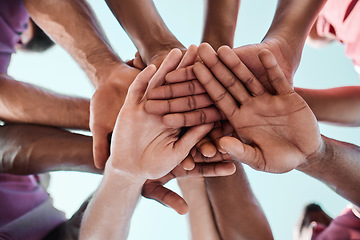 Image showing People, teamwork and hands together in collaboration, goals or community for motivation below. Closeup of group piling in team building, solidarity or trust in support for sports, rugby or match