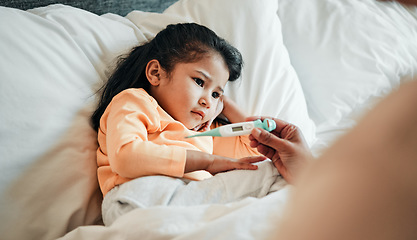 Image showing Girl child, thermometer for fever and sick in bed, health and wellness, parent monitor temperature at home. Headache, illness and young kid with the flu virus, medical help and support in bed