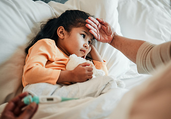 Image showing Girl child, check for fever and sick in bed with thermometer, health and wellness, parent monitor temperature at home. Headache, illness and young kid with the flu, medical help and support in bed