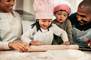 Image showing Family, mother and father with kids, baking and bonding with happiness, weekend break and home with love. Parents, mama and dad with children, recipe and cooking with ingredients, utensils and smile