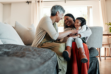 Image showing Happy, playful and family on sofa for a visit, conversation and bonding in a house. Smile, living room and a senior person, mother and girl kid for love, care and communication together on the couch