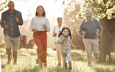 Image showing Family, running and parents or grandparents with girl child in park for freedom, adventure or playing in summer. Love, men or women with fun on grass field or forest in sunshine for care or happiness