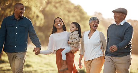 Image showing Parents, child and happy outdoor with grandparents, holding hands and comic laugh with conversation. Men, women and kid on walk in nature, funny memory and bonding with love, vacation or care in park