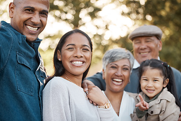 Image showing Parents, child and grandparents with portrait in park for memory, smile and bonding for holiday in nature. Men, women and girl kid with hug, face and excited and vacation family in summer sunshine