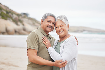 Image showing Senior, couple and hug with portrait on beach in nature together for support, relax and connection with smile. Commitment, man or woman with love embrace for peace, trust and vacation at ocean or sea