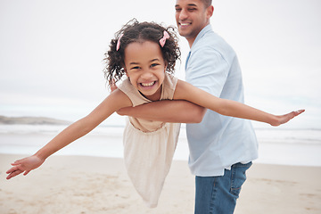 Image showing Dad, daughter and beach while playing, airplane and smiling for fun, excitement and happiness on vacation, holiday and memories. Freedom, fly and joy with blue skies, outdoor and bonding together